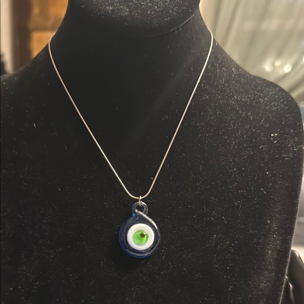 Artisan created glass, evil eye pendant on Sterling silver serpentine chain